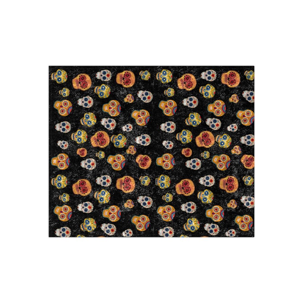 Halloween blanket in black with orange, brown and white skeletons
