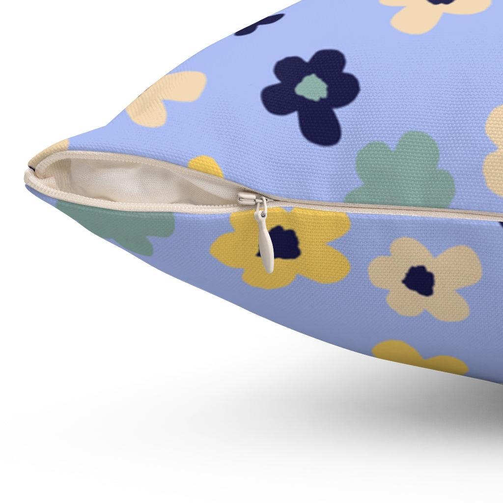 abstract flower pillow in light blue with dark blue and yellow flowers