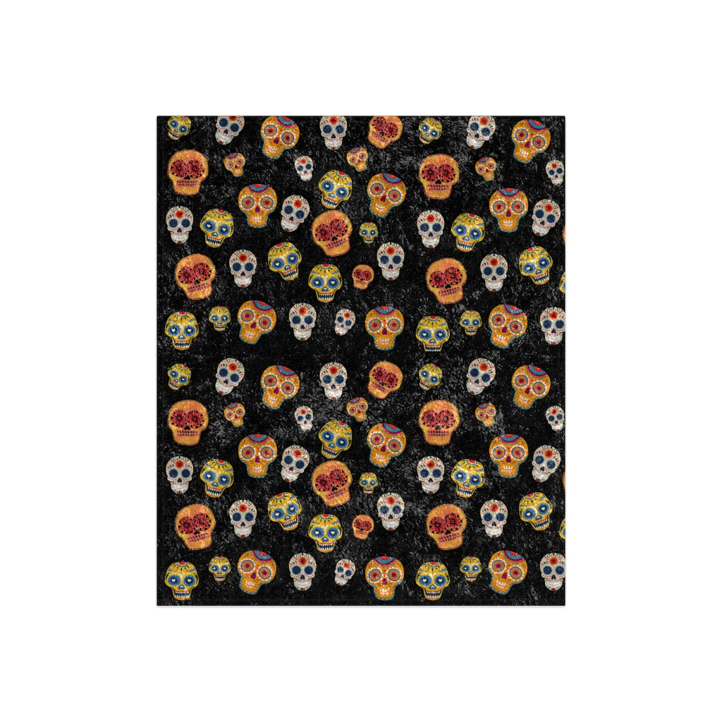 boho halloween blanket with orange, brown and white skeletons