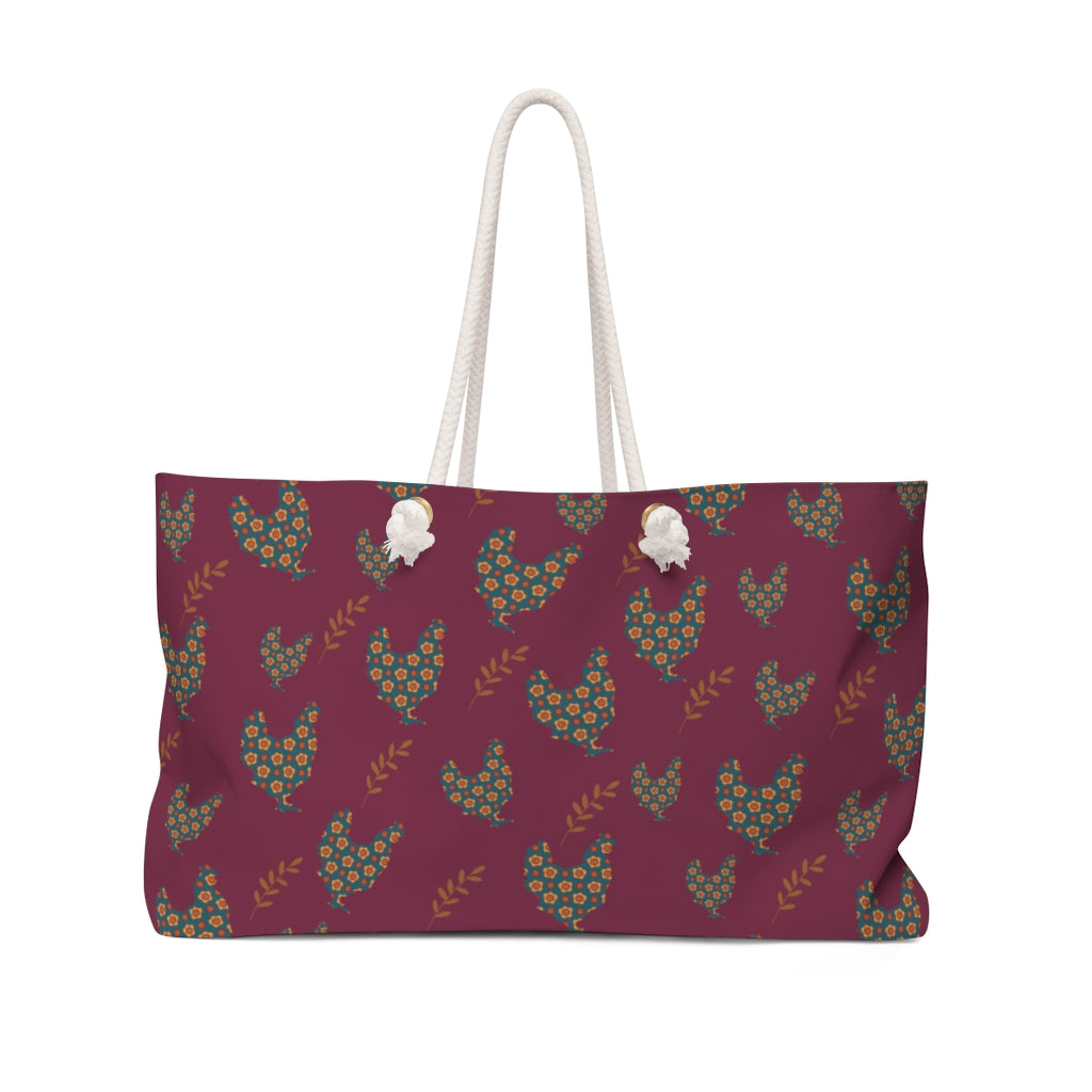 farmhouse rooster pattern weekender bag with roosters and leaves on burgundy background