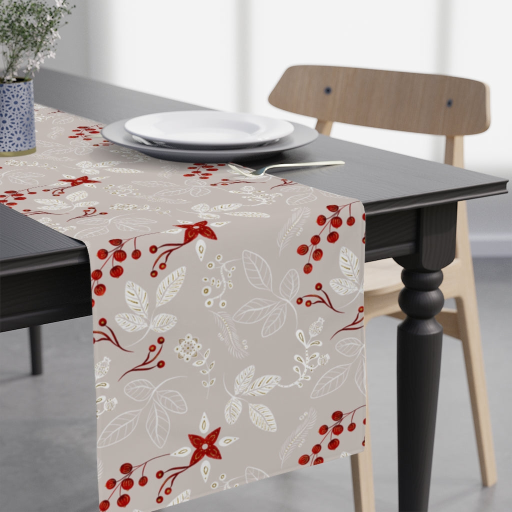 grey table runner with leaves and red winter berries