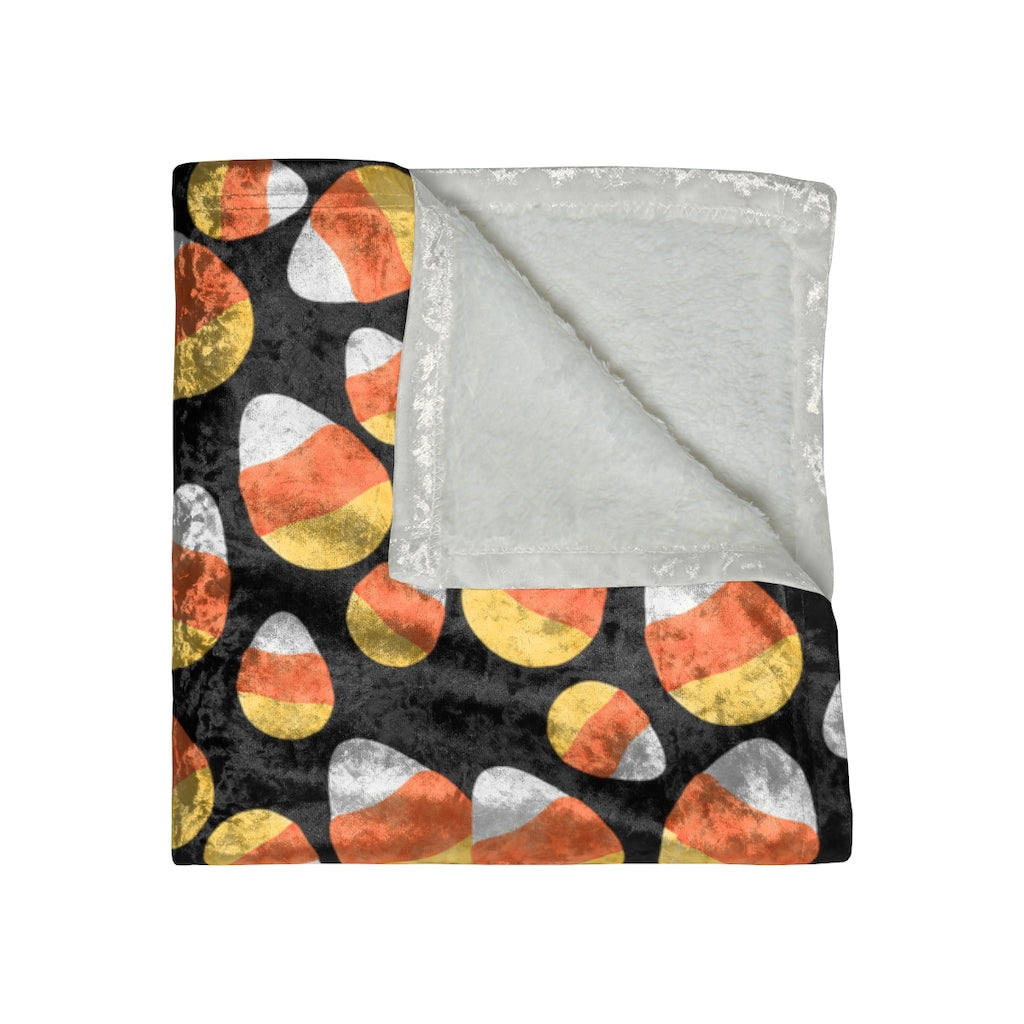 folded view of candy corn blanket for halloween