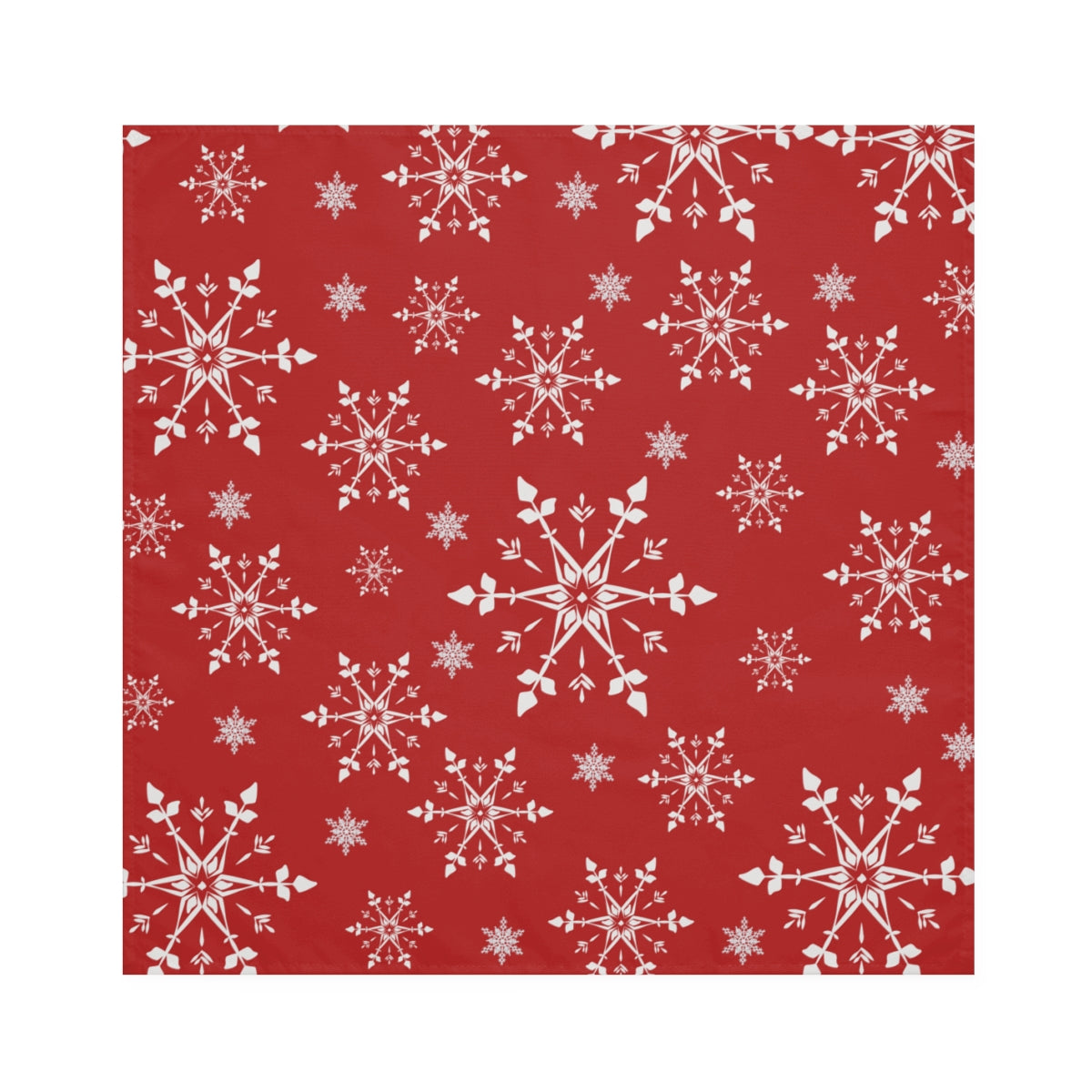 flat view of red christmas cloth napkins with white snowflakes