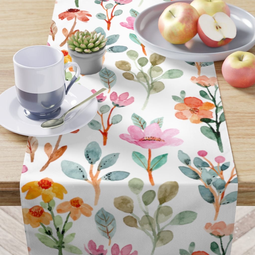 watercolor table cloth with pink, orange, and blue flowers