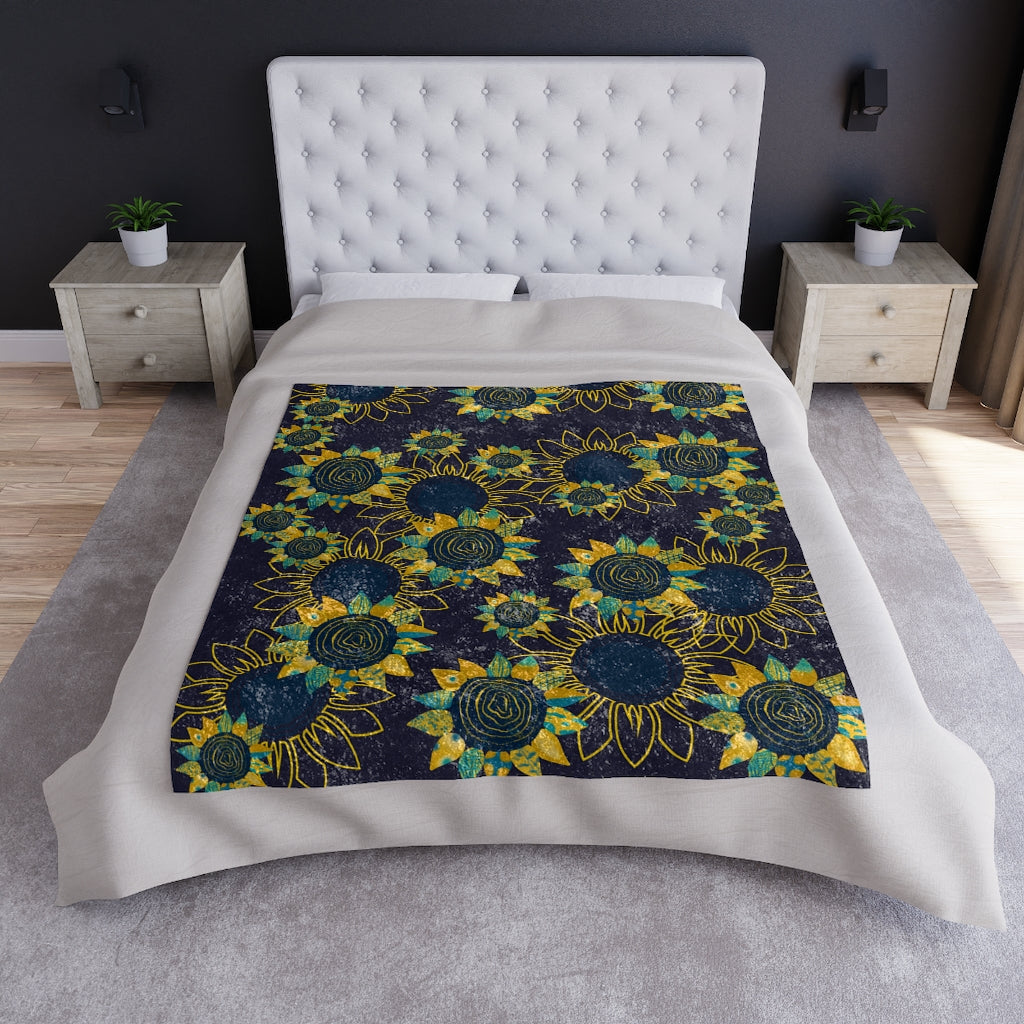 sunflower blanket displayed on a bed