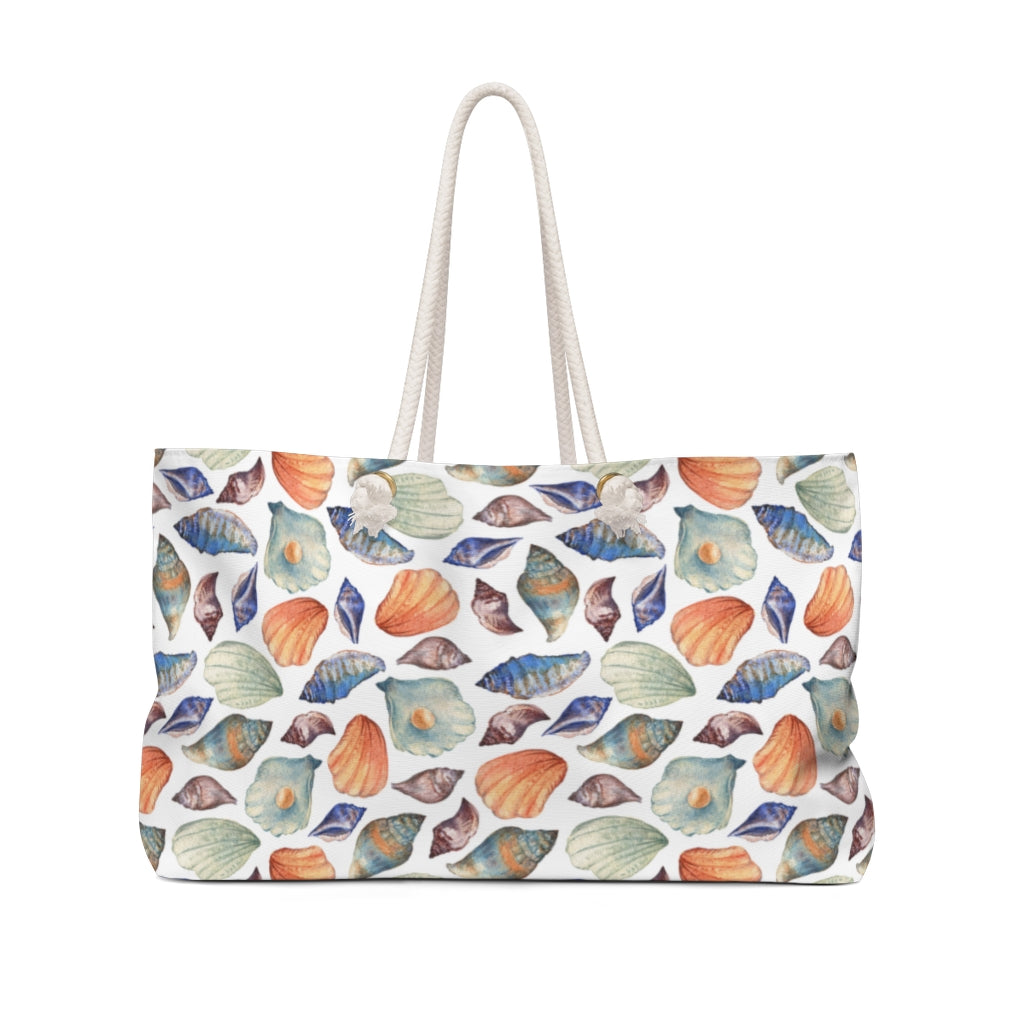 nautical travel bag with sea shells on a white background