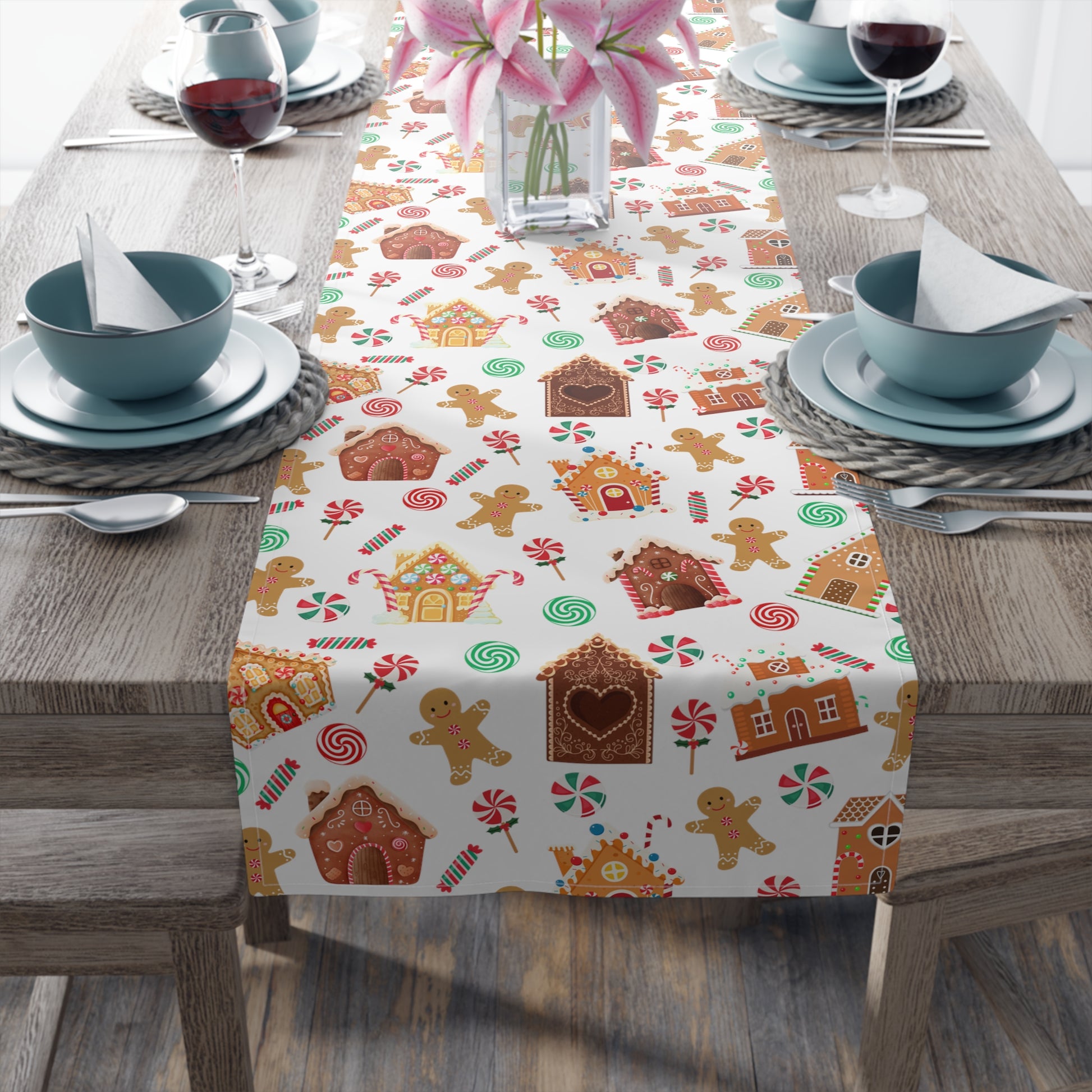 green and red christmas table runner with gingerbread house print with christmas candy