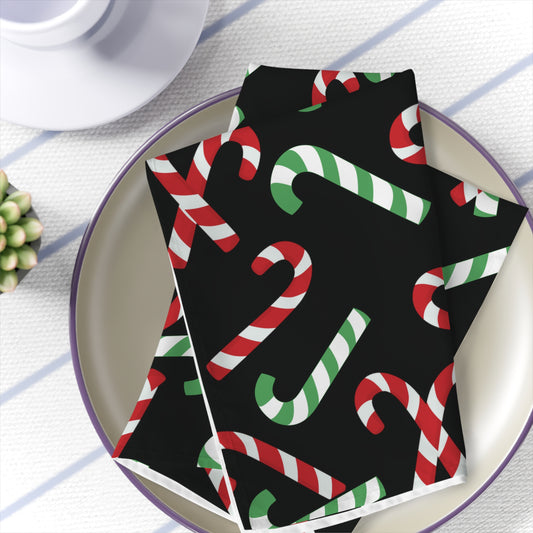 black cloth napkins with red and green candy cane print for christmas dinner in a set of 4