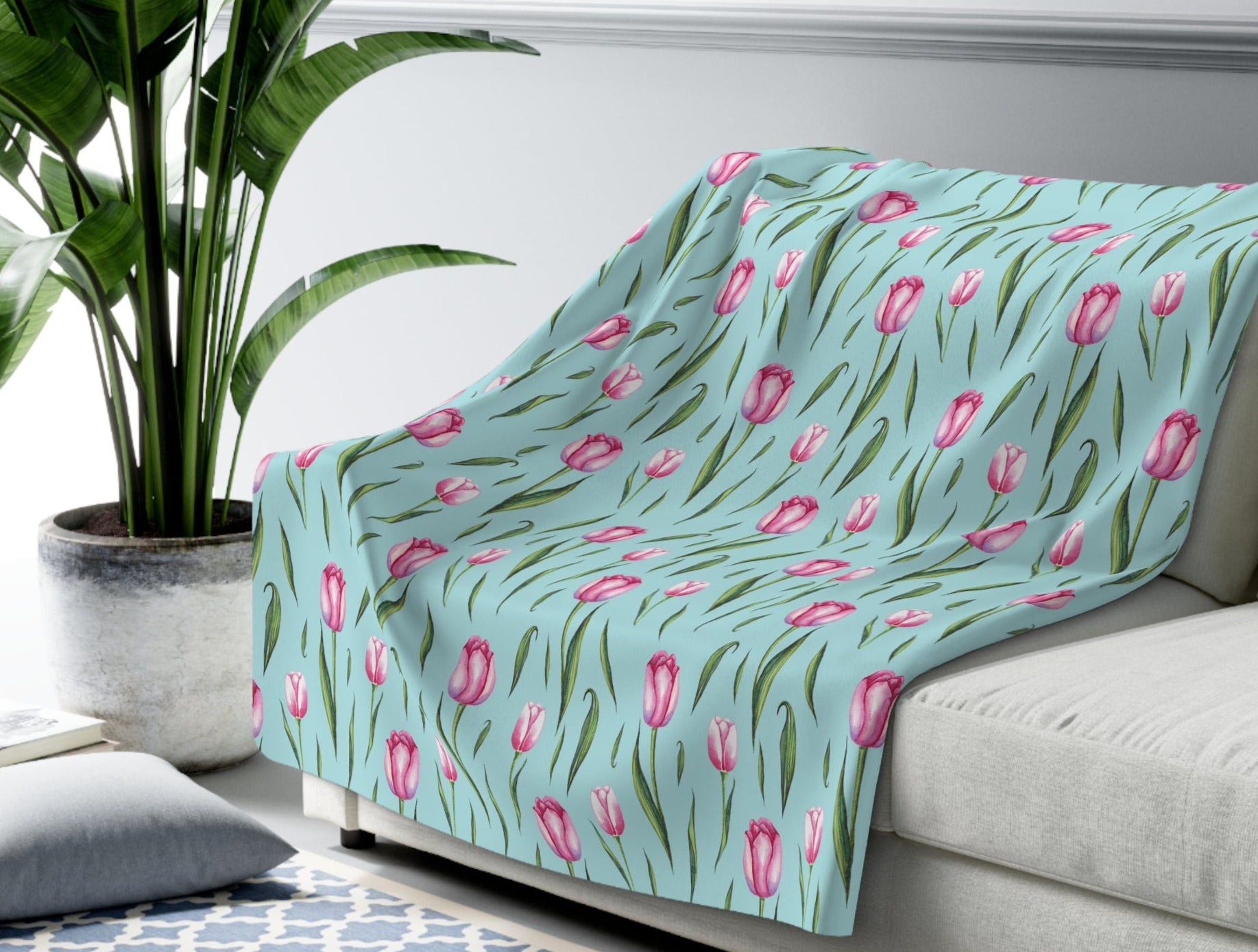 teal blanket with pink tulip print