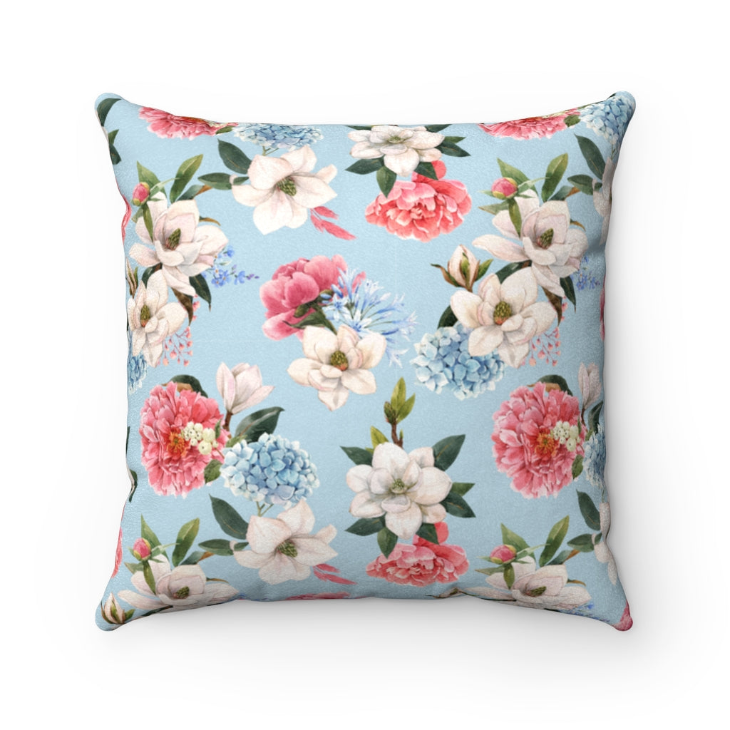 blue floral pillow with pink, white and blue hydrangeas