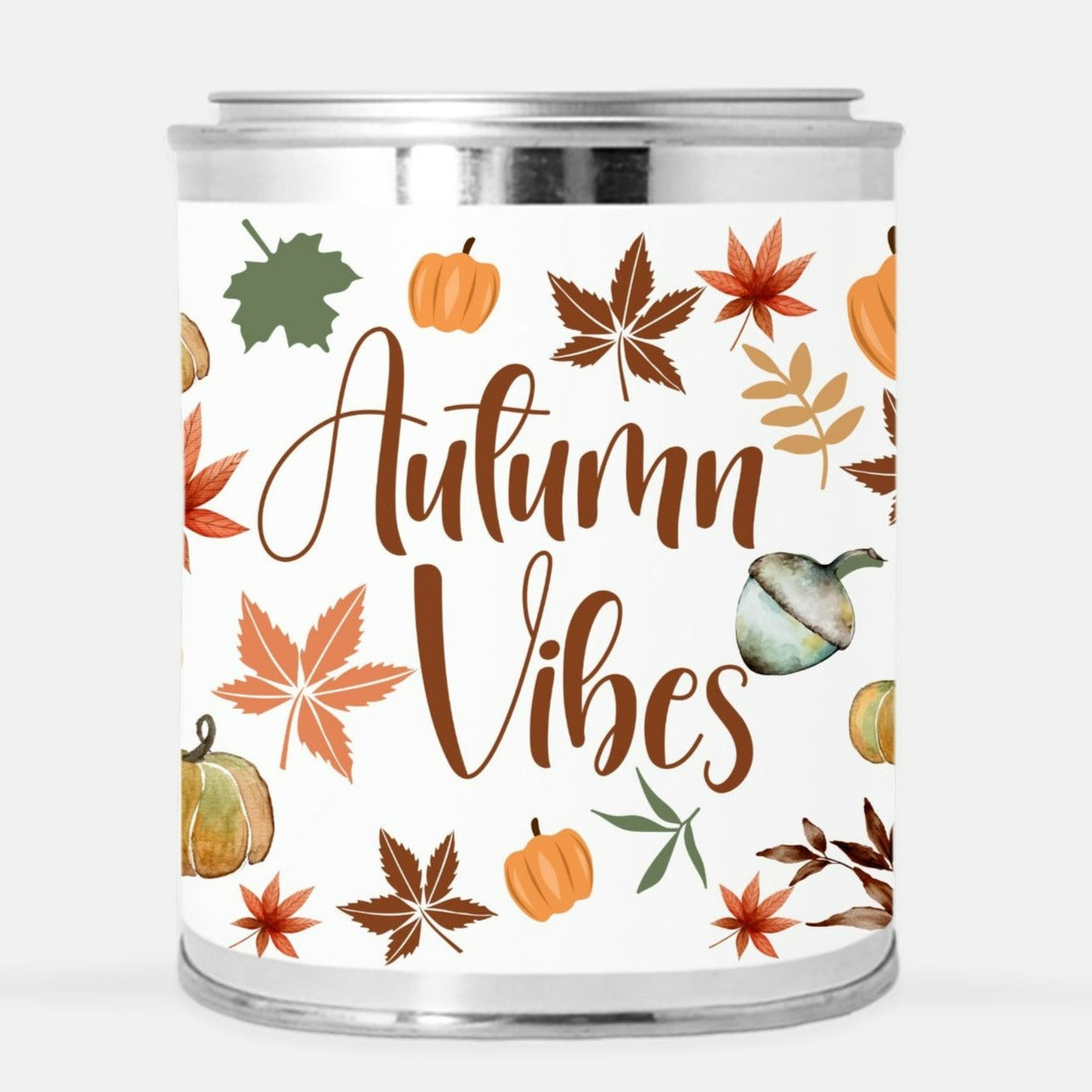 fall candle with autumn vibes and pumpkin and leaves pattern.