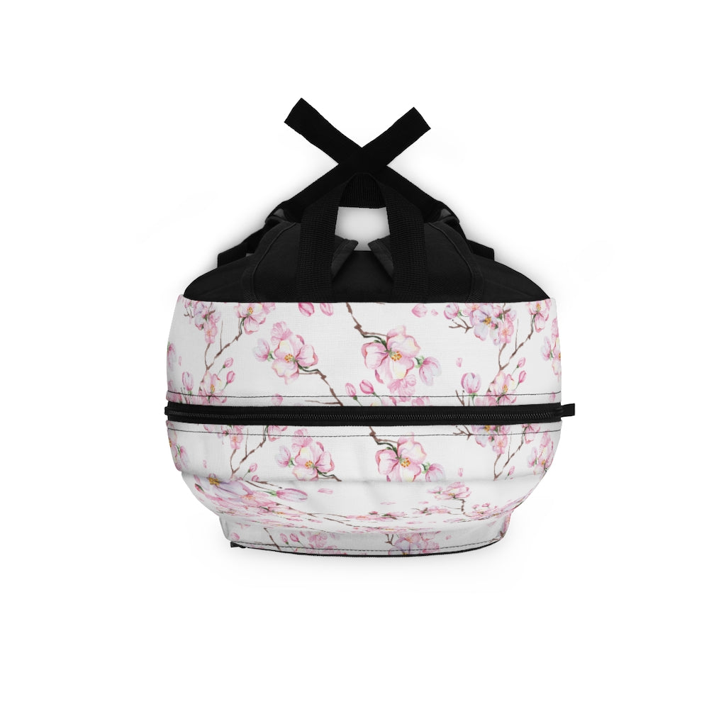top view of girls bookbag with pink and white cherry blossom branches