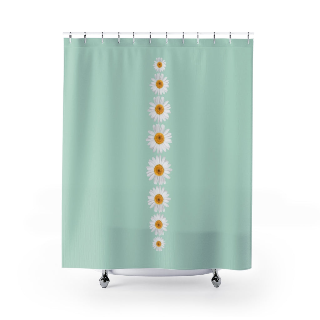 green shower curtain with white daisy pattern
