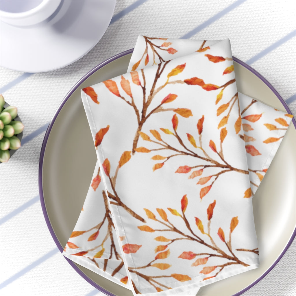fall leaves decor featuring fall leaves napkins with orange, red and yellow changing leaves pattern