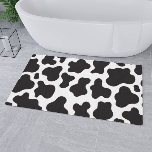 farmhouse mat with black and white cow print pattern