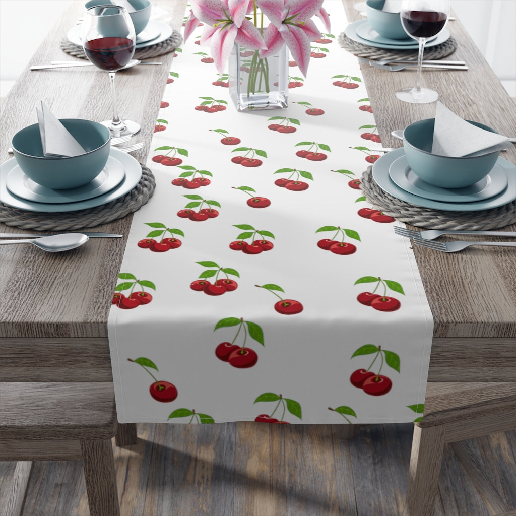 cherry table runner with red cherry and leaves pattern on white background