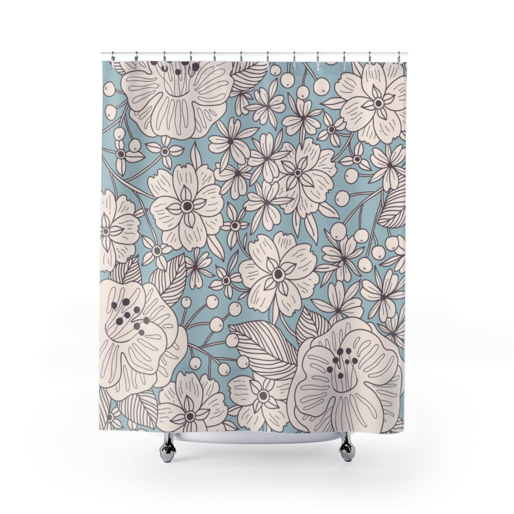 blue shower curtain with white flowers