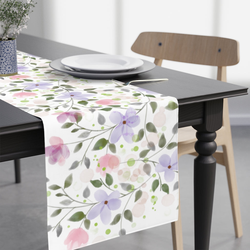pink and purple flower table runner with greenery