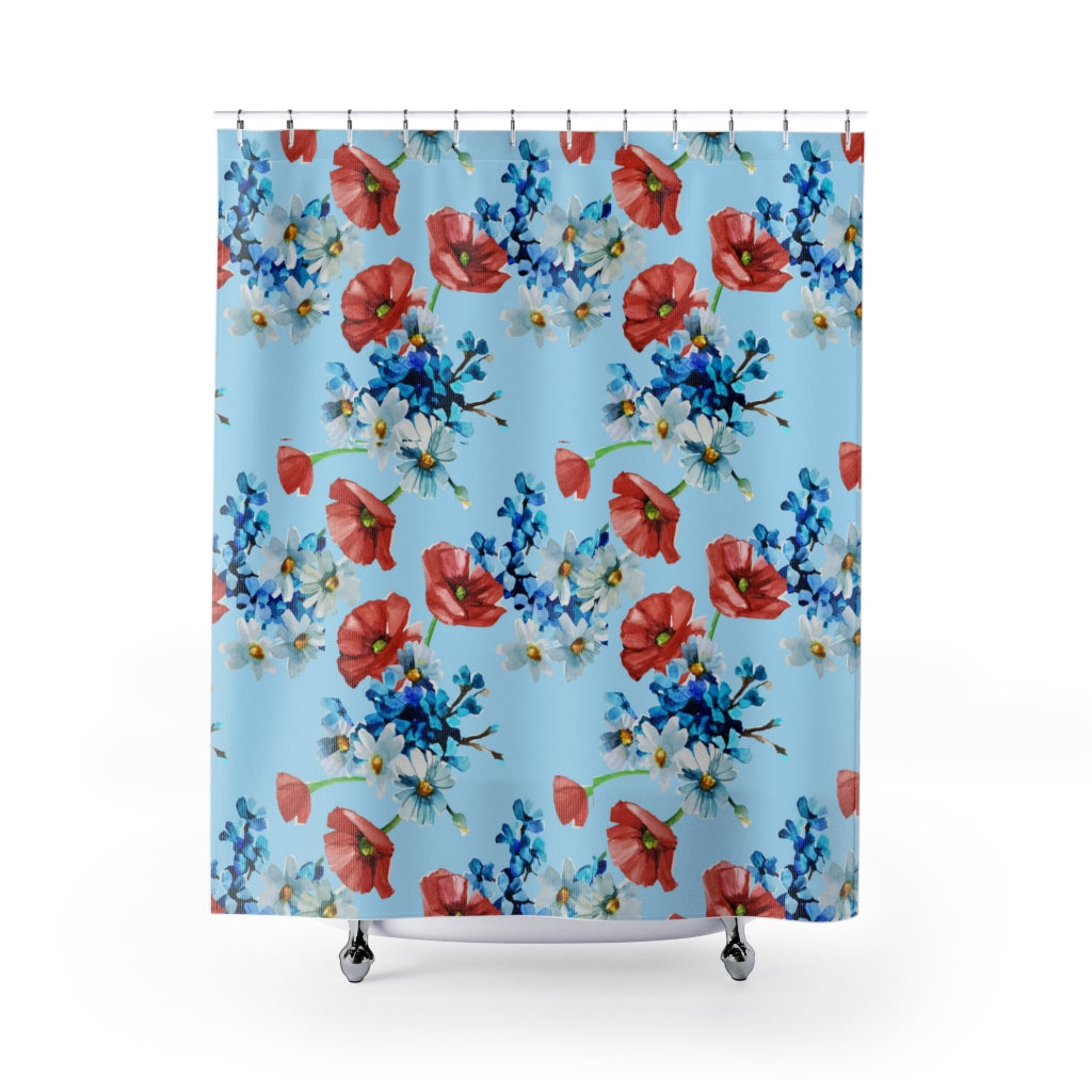 blue shower curtain with red, white and blue flowers.
