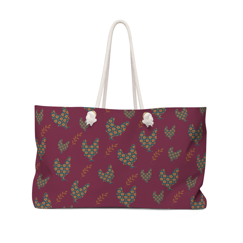 farmhouse rooster pattern weekender bag with roosters and leaves on burgundy background 