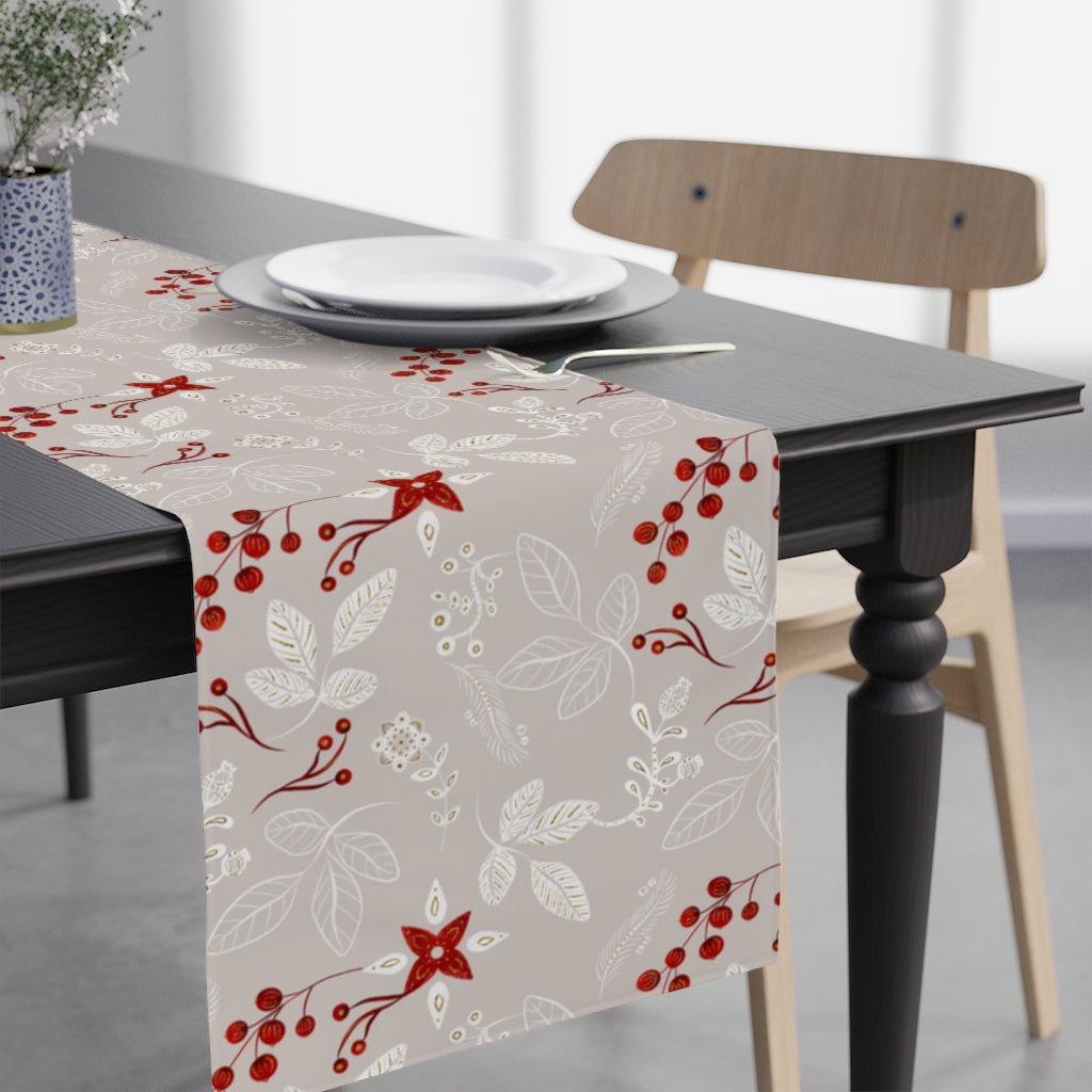 grey table runner with leaves and red winter berries 