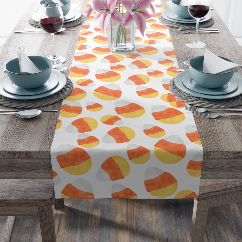 halloween table runner with candy corn pattern in orange, yellow and white colors