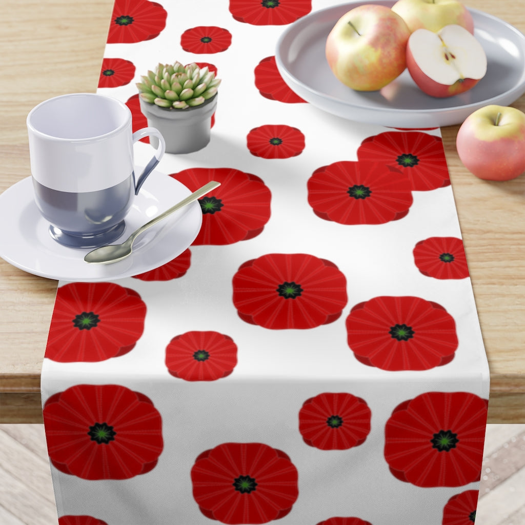 veterans day table runner with red poppy pattern on a white background