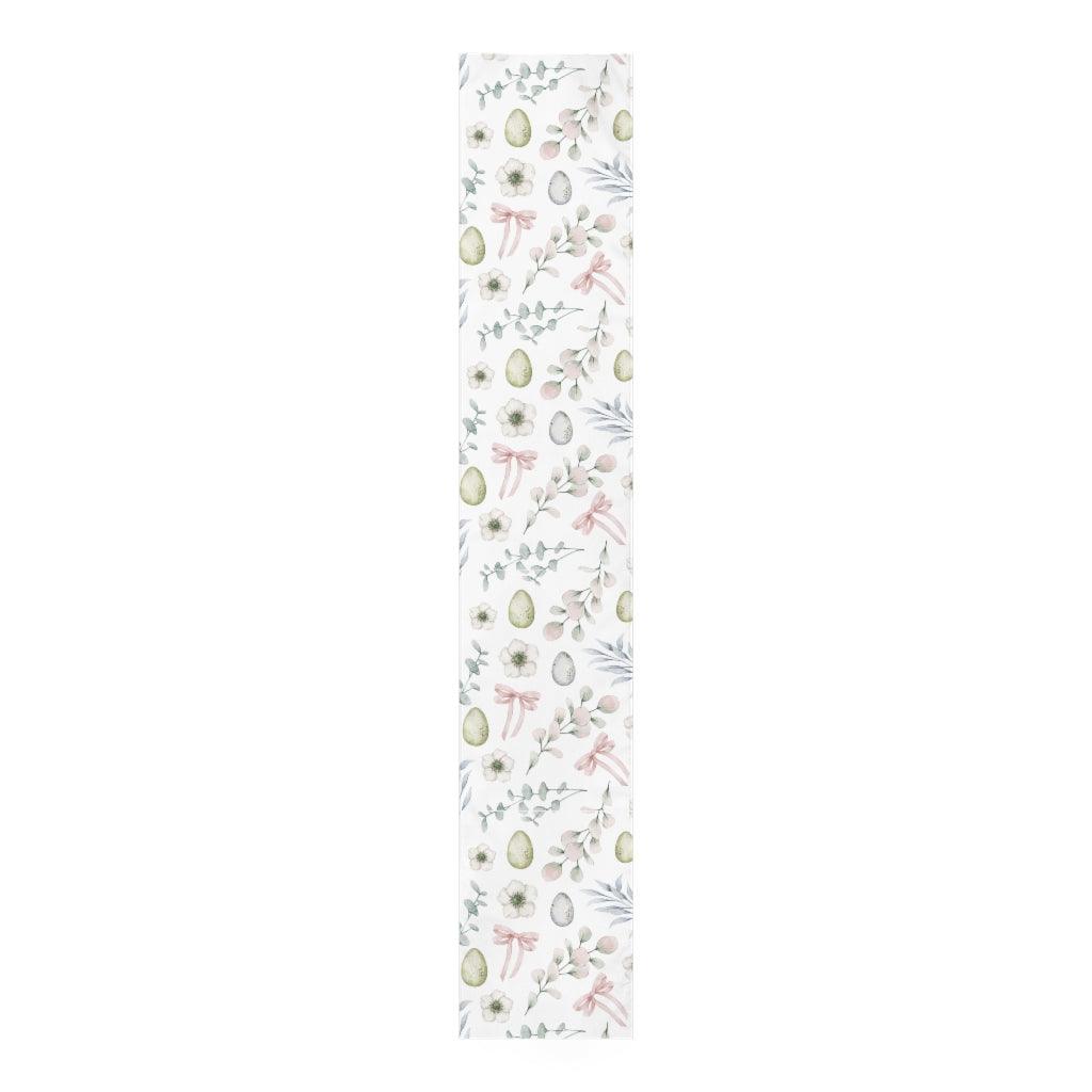 pastel easter table runner with easter eggs, flowers and leaves 