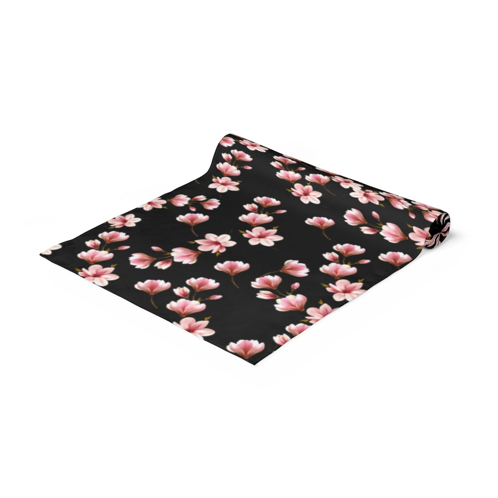 black table runner with pink magnolia flower pattern