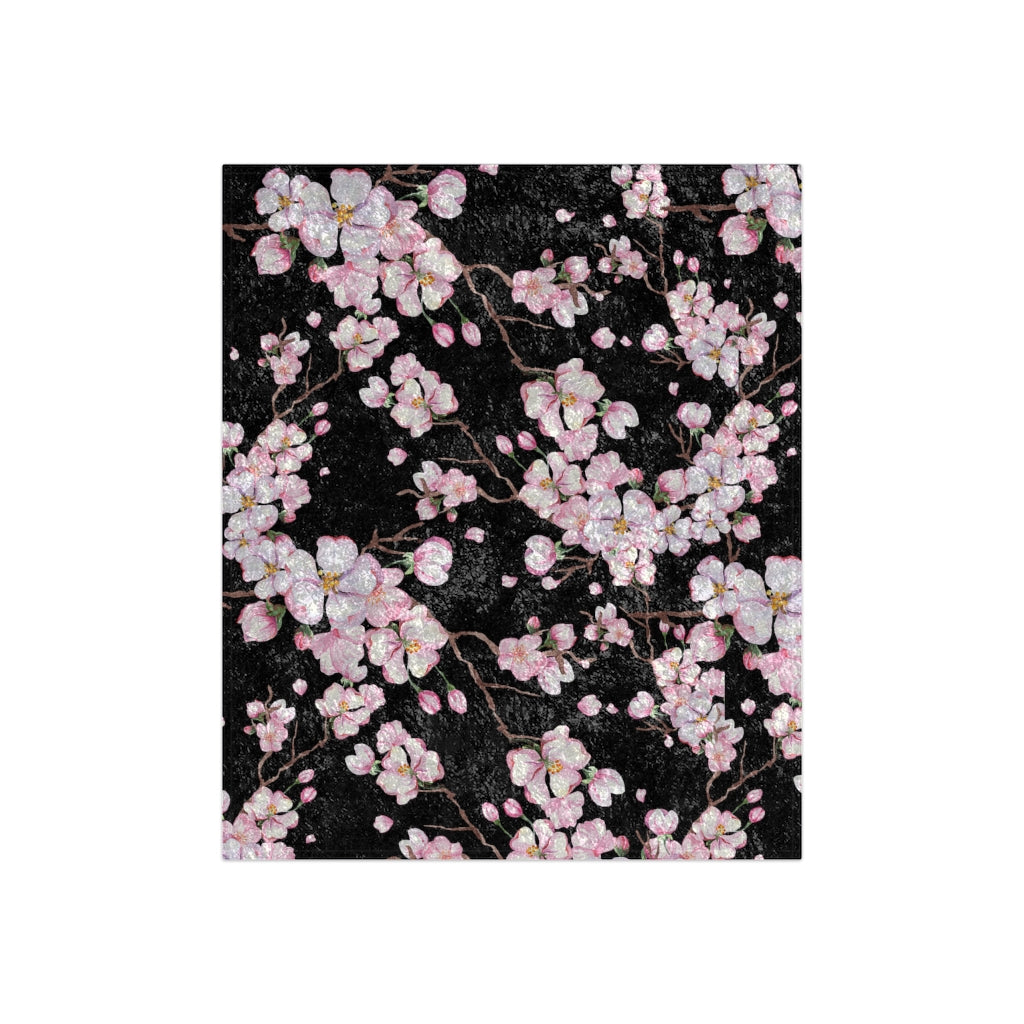 cherry blossom blanket with white and pink flowers on back background