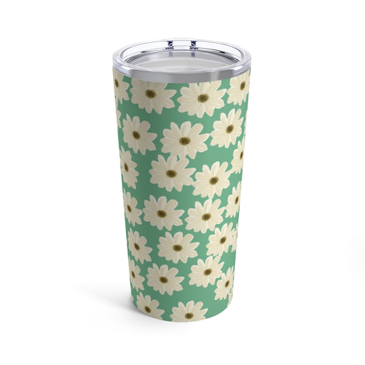 daisy tumbler with white daisy pattern with teal background