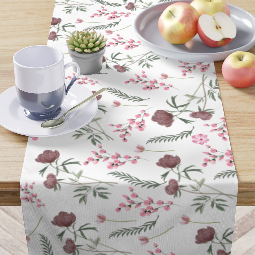 dusty pink rose table runner with green leaves and pink flowers