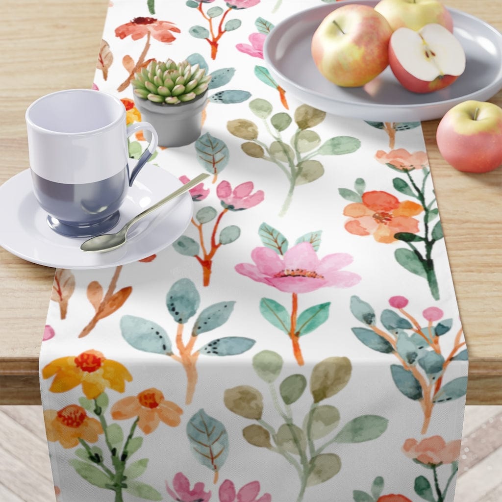 watercolor table cloth with pink, orange, and blue flowers 