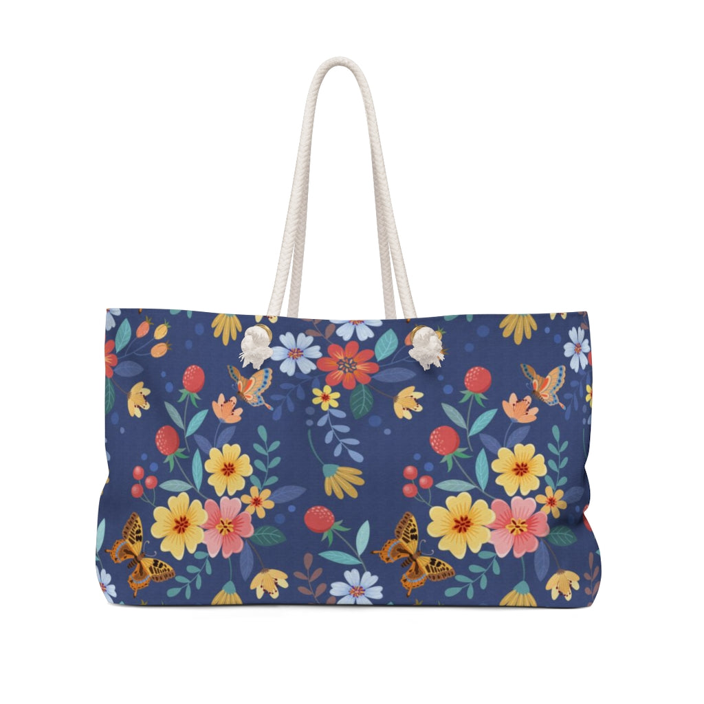 blue travel bag with flowers and butterflies 