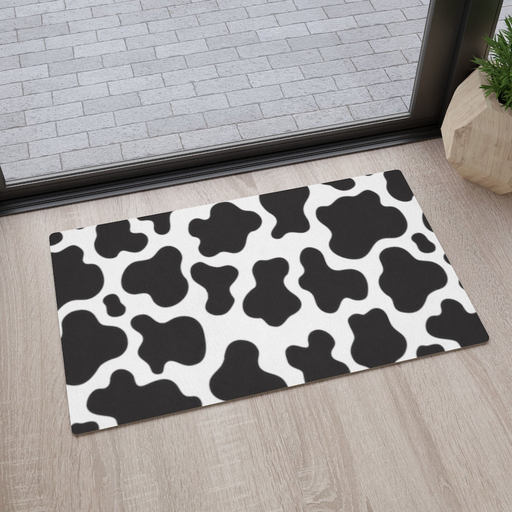 farmhouse mat in black and white cow print pattern
