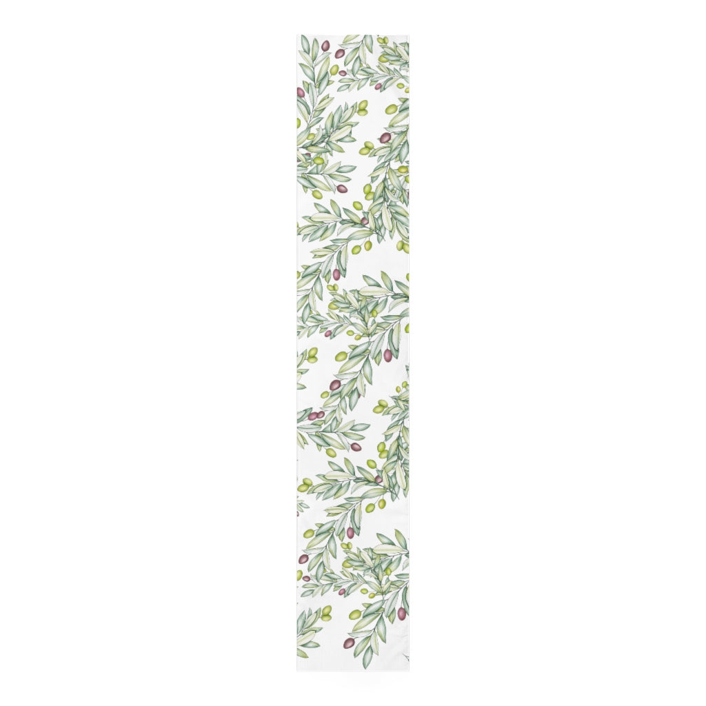 leaf pattern table runner with green and purple olives 