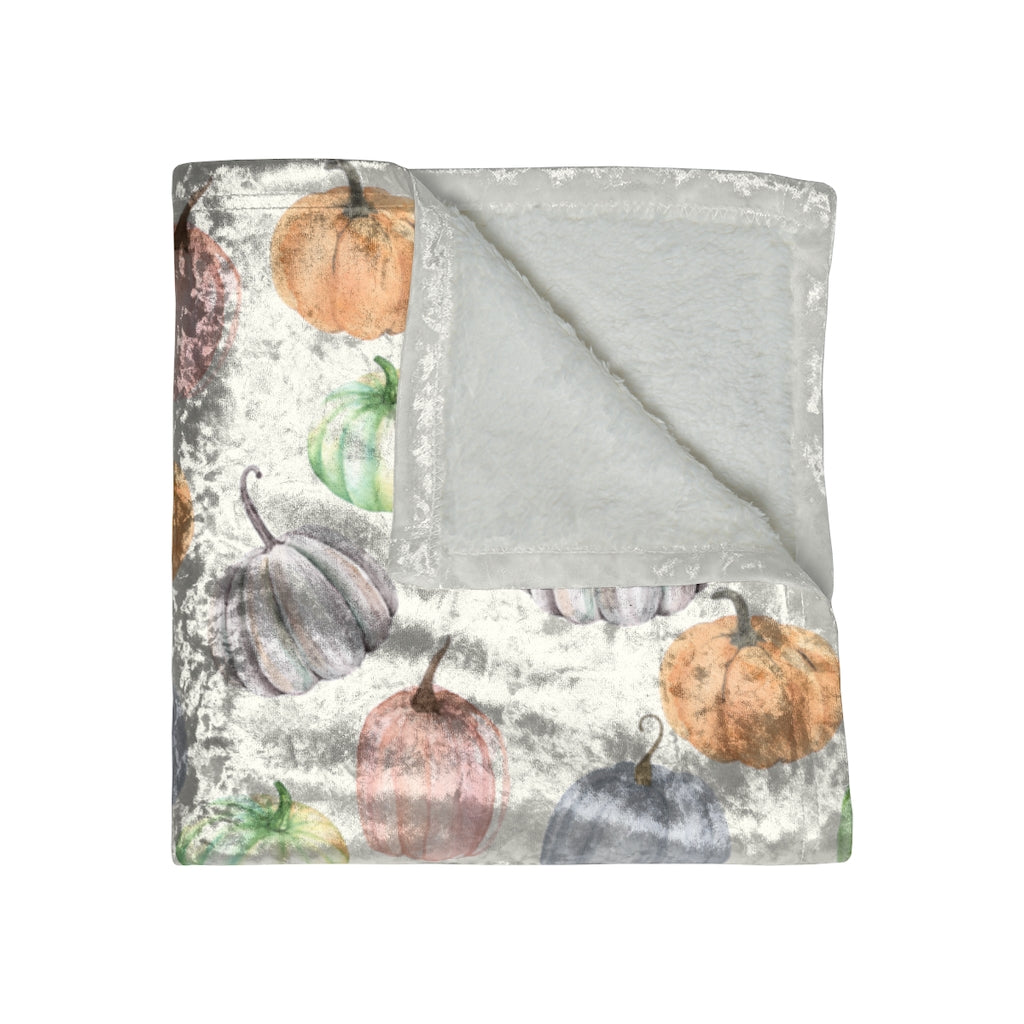 folded view of the pastel pumpkin velvet blanket for fall , thanksgiving or Halloween
