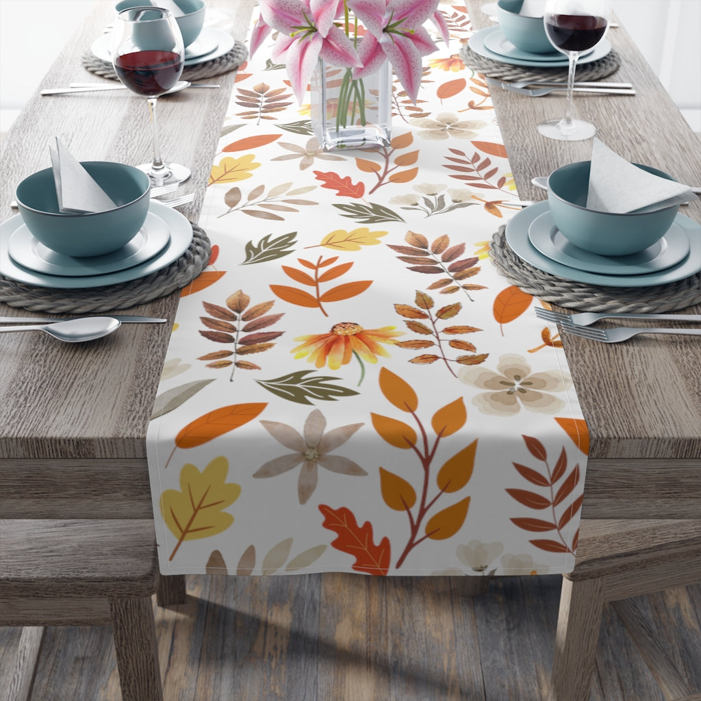 fall leaves table runner in orange, brown and green print