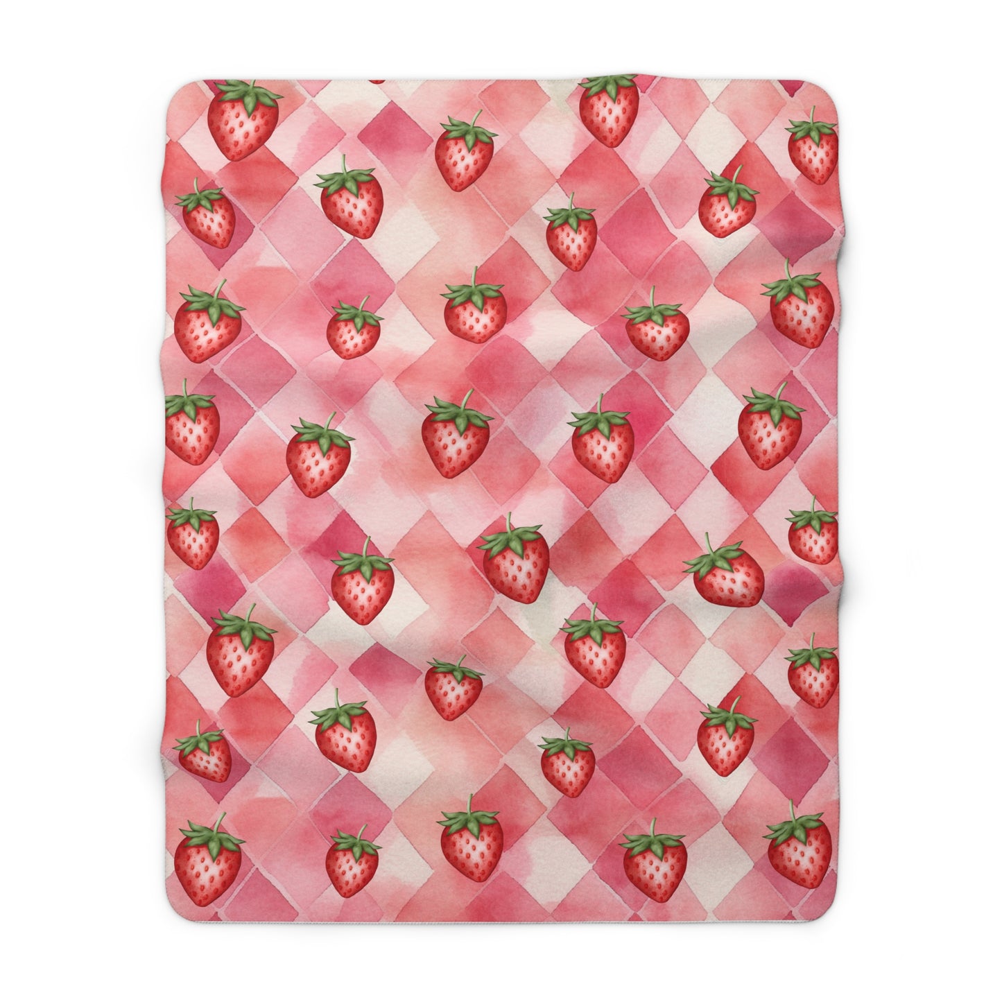 red and pink strawberry blanket on a checkered background perfect as a picnic blanket