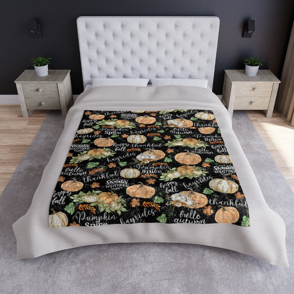 fall pumpkin blanket displayed on a queen size bed