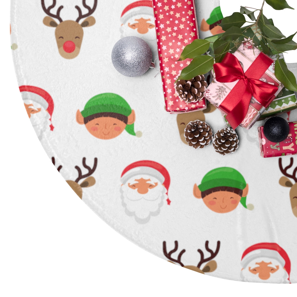 christmas tree skirt with santa, elves, and reindeer pattern on white background