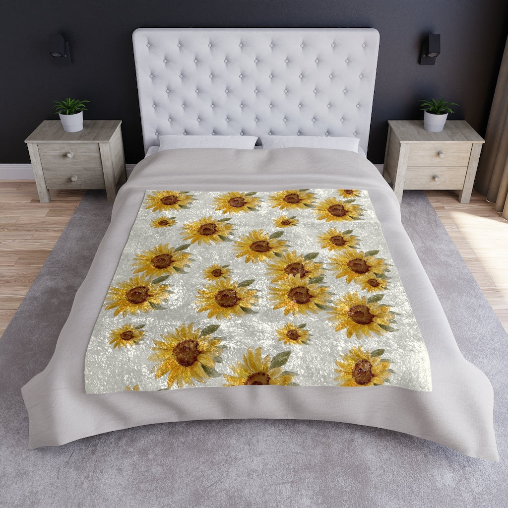 sunflower blanket displayed on a bed