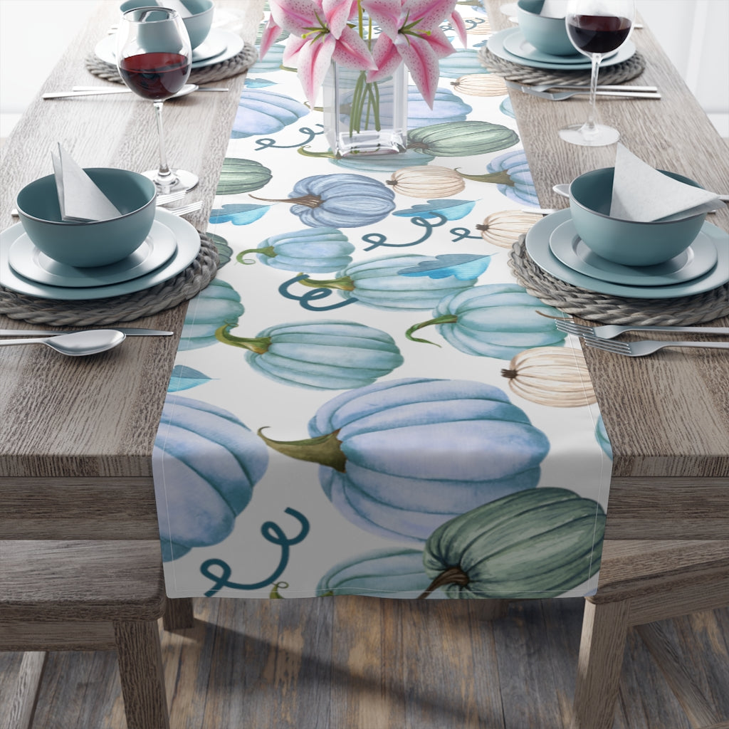 pumpkin table runner with blue, orange and greeen pumpkin pattern with fall leaves decor