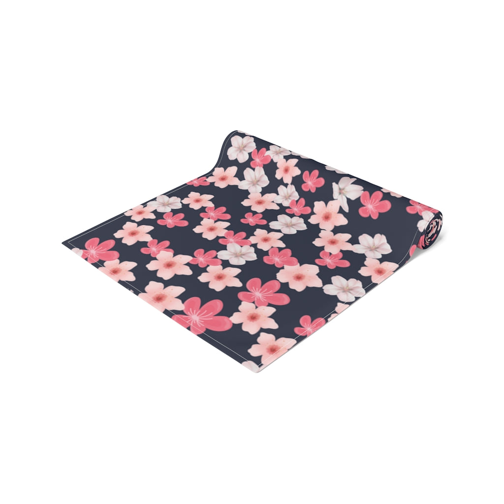navy blue table runner with shades of pink and white flowers