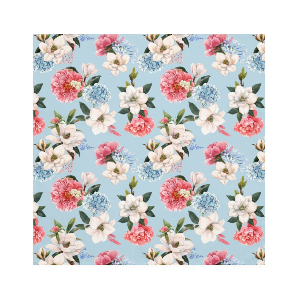 flat view of cloth floral dinner napkins in blue with white, pink and blue hydrangeas