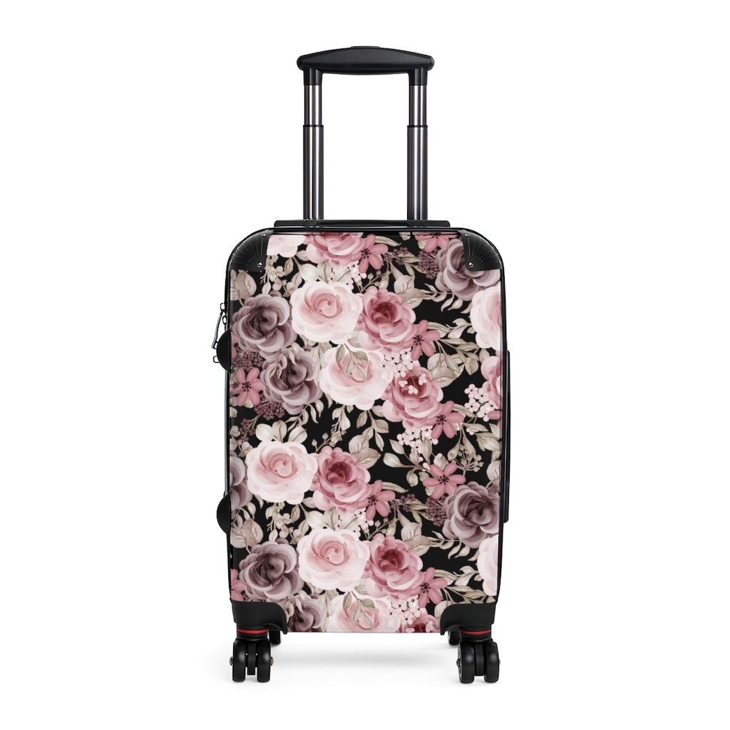 black suitcase with pink and purple roses and green leaves
