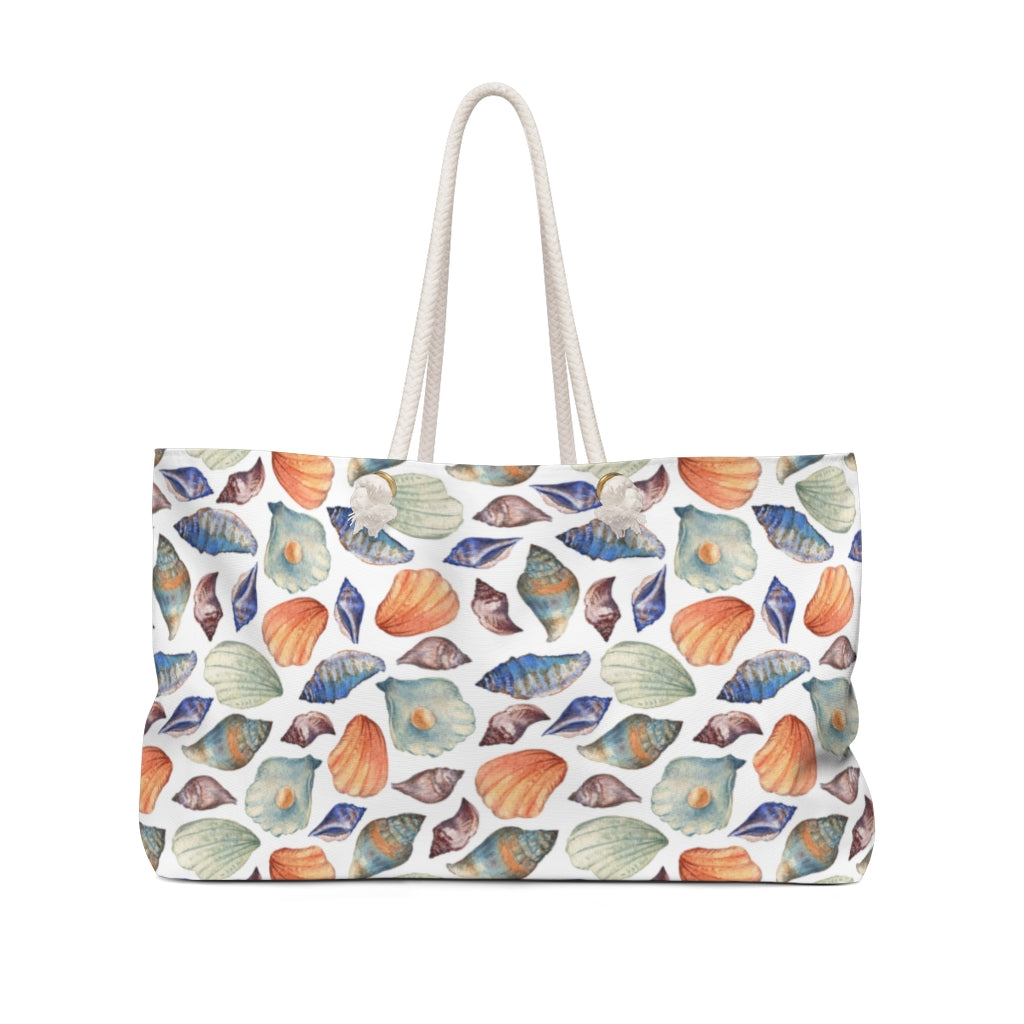 nautical travel bag with sea shells on a white background 