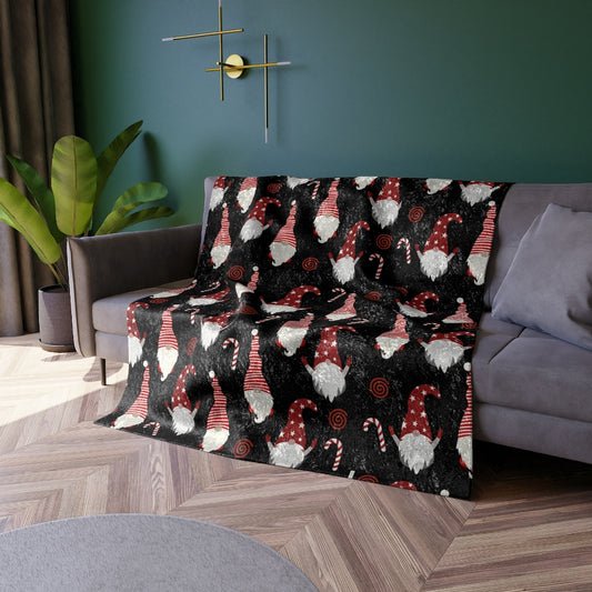 red and black christmas blanket with gnome and candy cane pattern