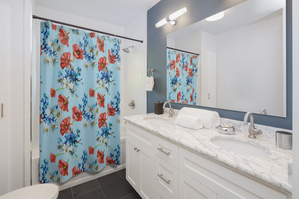 summer floral decor featuring a blue shower curtain with red flowers 