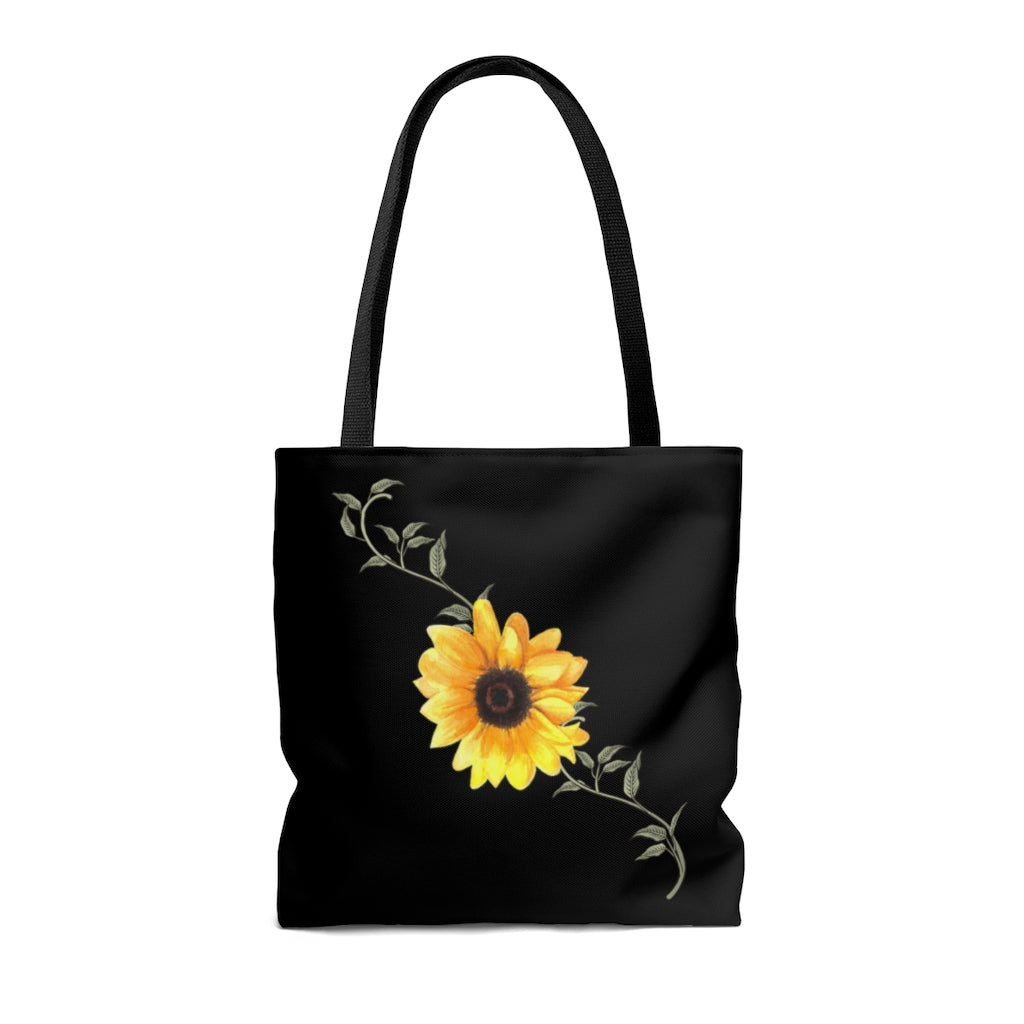 black tote bag with yellow sunflower and green leaves.